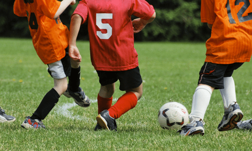 Youth playing soccer